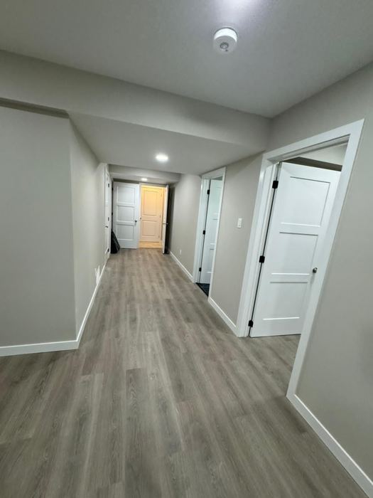 After: Basement hall: framing to finished